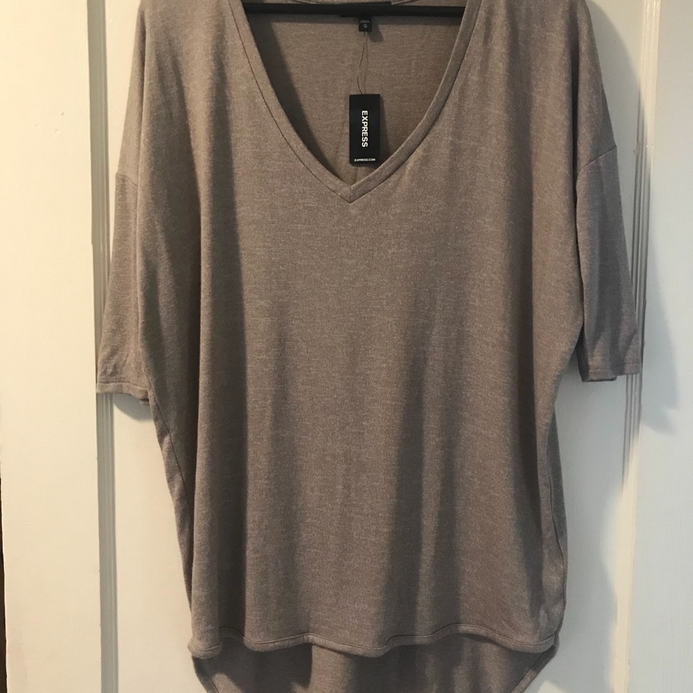 High low purple shirt. Never been worn!!